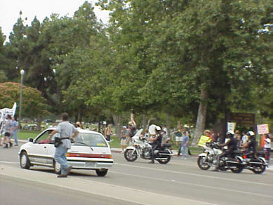 The Traitors play live on a flatbed truck, through a solar powered PA, in an anti-fraudulent energy crisis, anti-Bush demonstration, Long Beach CA, July 4, 2001 - CLICK FOR NEXT IMAGE